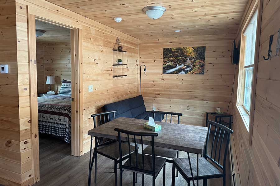 Futon Sofa And Dinette Table & Chairs In The Cedar Suite Rental Cabin At The Pmr