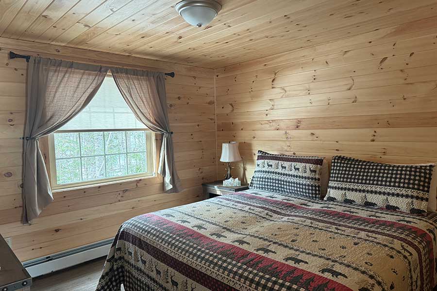 Bedroom With King Bed In The Cedar Suite Rental Cabin At The Pmr