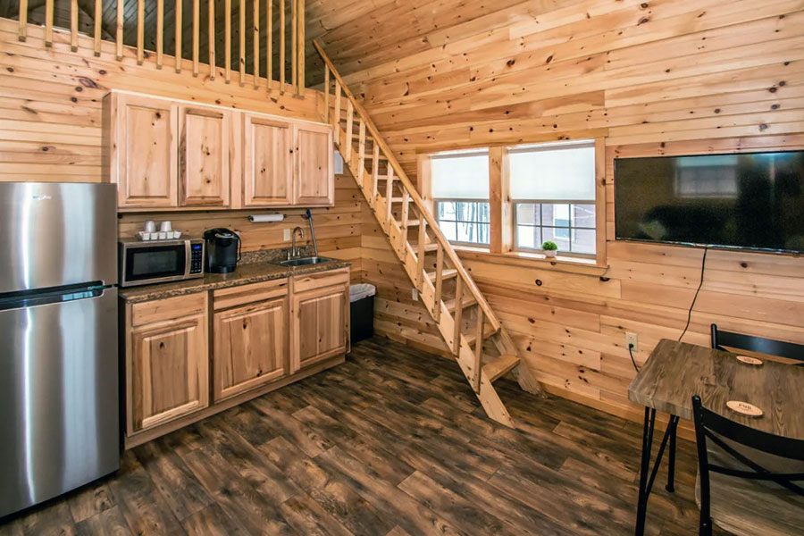 Kitchenette With Stairs To The Open-style Children's Loft In The Lakeside Pine Suite Rental Cabin At The Pmr