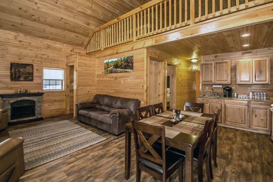 View Of Living Room And Kitchenette In The Oak Premier Rental Cabin At The Pmr