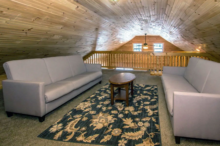 Loft Area With Two Futon Sofas In The Oak Premier Rental Cabin At The Pmr