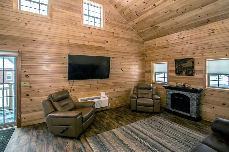 Two Reclining Chairs In The Sitting Area Of The Oak Premier Rental Cabin At The Pmr