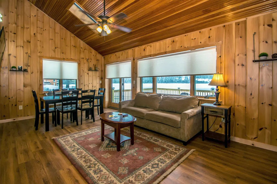 Living Room With Sofa And Dining Table & Chairs In The Rosewood Cottage Rental Cabin At The Pmr